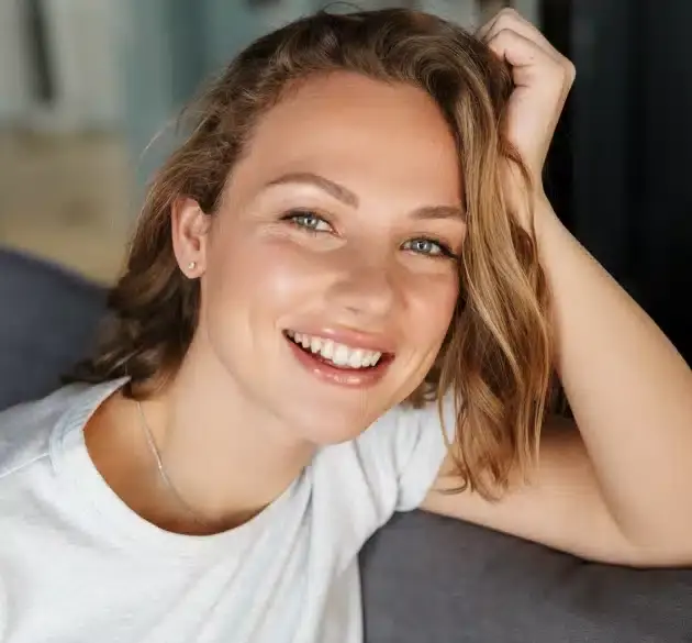 Young woman smiling after cosmetic dental bonding treatment in Houston.